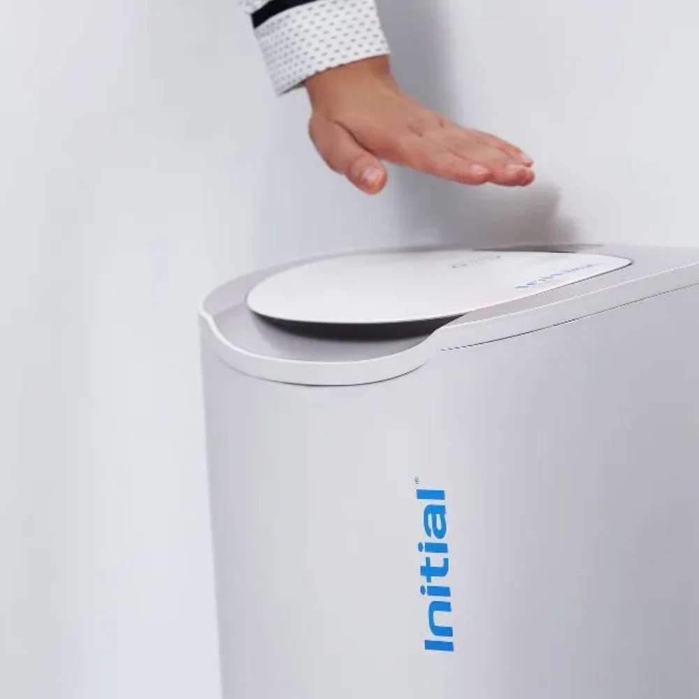 hand waving over no touch sanitary bin 