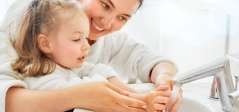 Washing hands child and adult