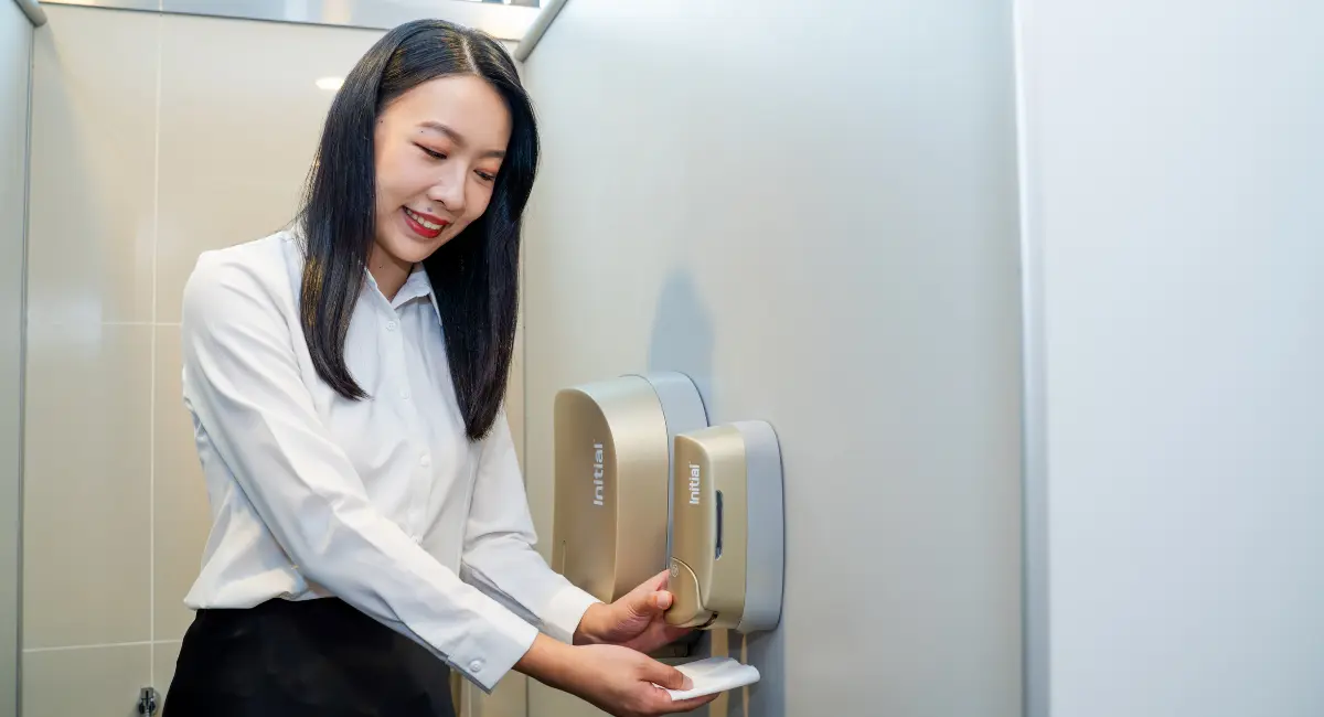Technician with sanitary bin
