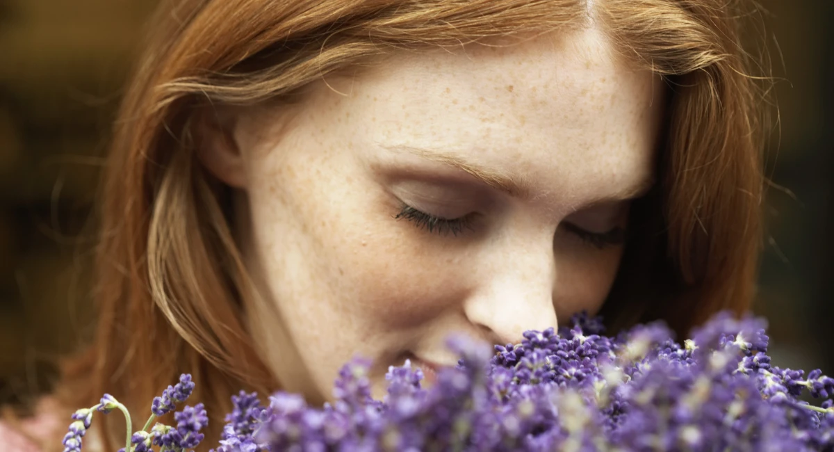 woman smelling flowers