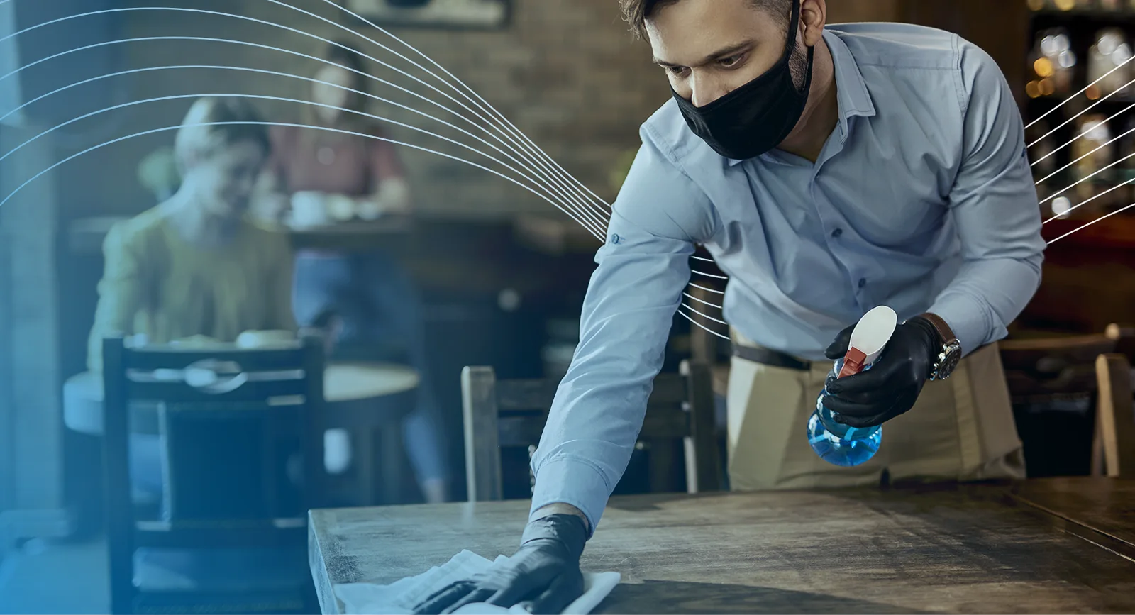 Man wiping table