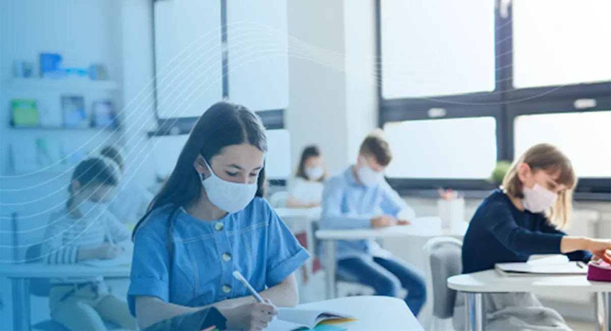 Children in a classroom wearing masks