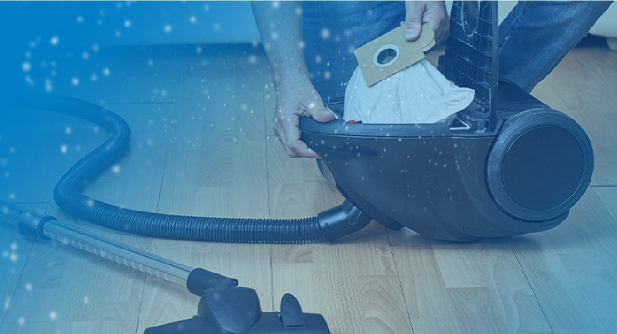 Particules en suspension autour d'un aspirateur ouvert lors du changement de sac