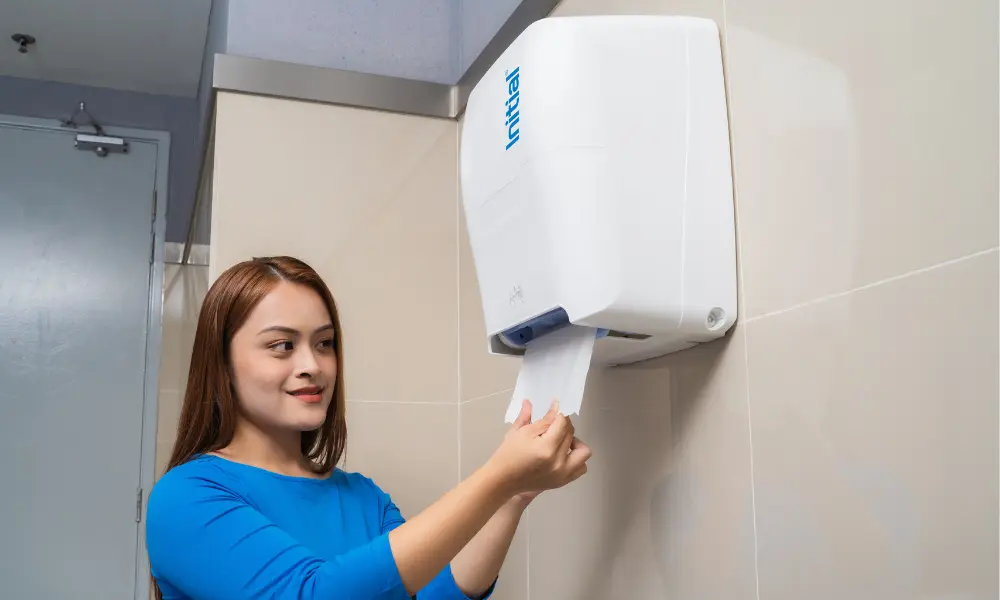 a woman pulling paper towel